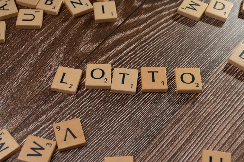 Powerball’s $562 Million Jackpot, Explained: Odds, Rollovers and Reality Wooden letter tiles spelling the word LOTTO on a rustic wooden table
