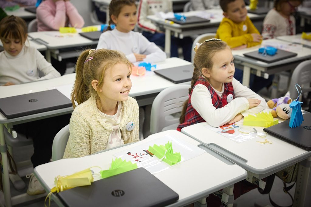 Smartphone Bans in Class Linked to Stronger Results in New Study Students in a phone-free classroom focusing on a lesson while smartphones stay put away